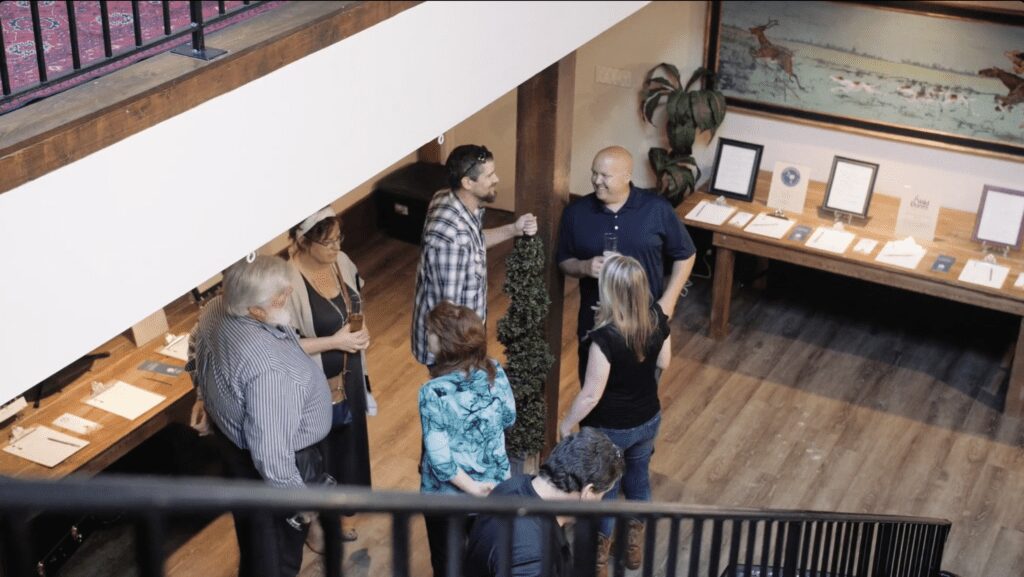 Group of people socializing indoors at a casual gathering.